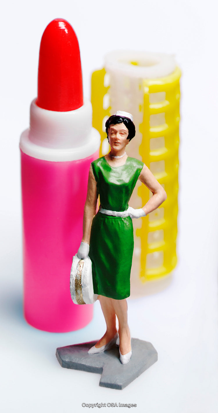 Miniature Toy Display of a Lipstick, Hair Roller, and Decorated Figurine