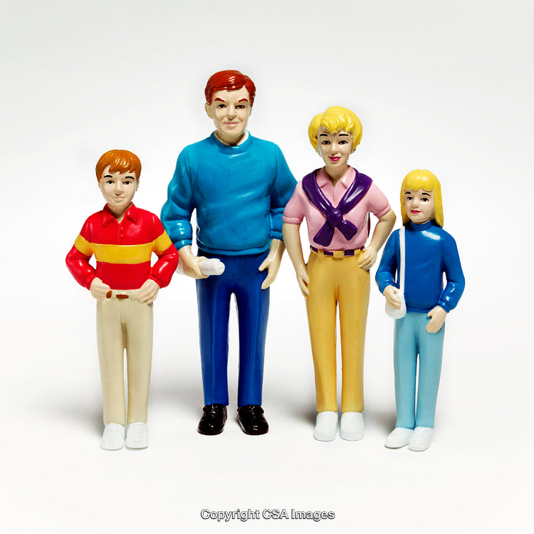 Colorful Plastic Figurines of a Family of Four Standing Together