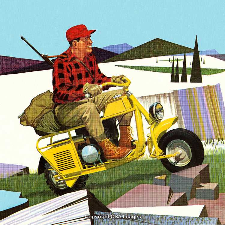 Man Riding a Yellow Motorcycle in a Scenic Natural Landscape