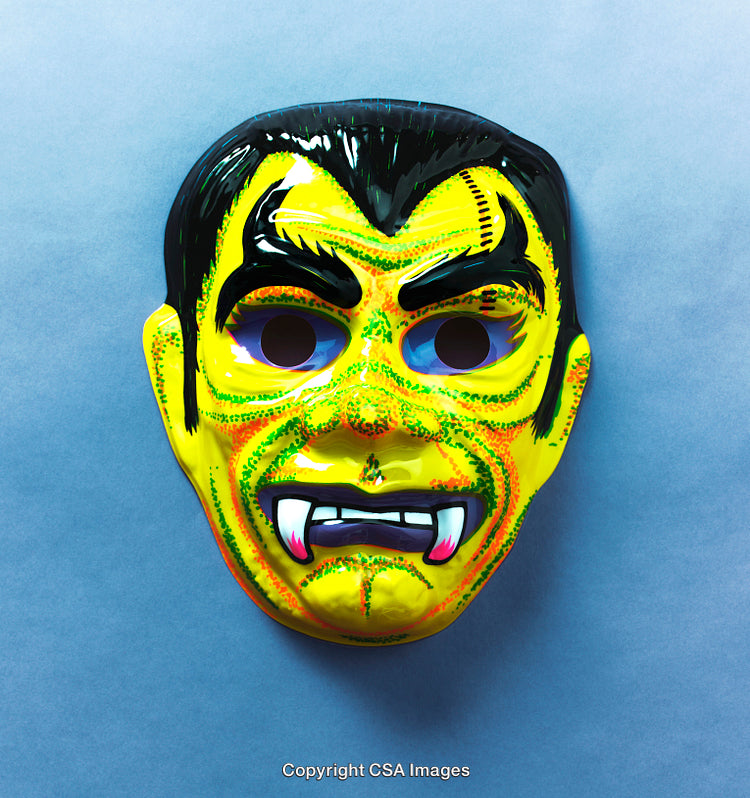 Colorful Plastic Vampire Mask on Blue Background