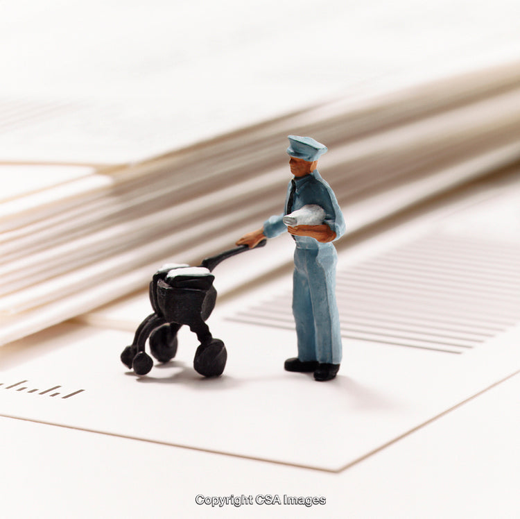 Miniature Postal Worker Delivering Mail Next to Stacked Papers