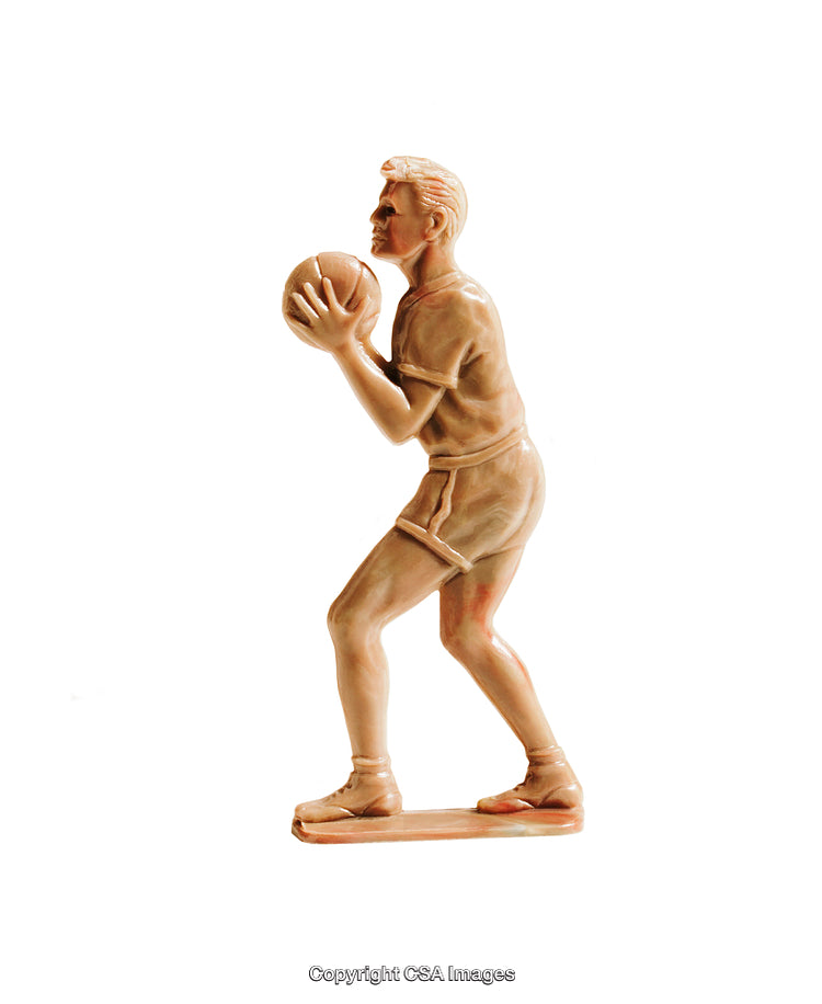 Vintage Ceramic Figurine of a Basketball Player Holding a Ball