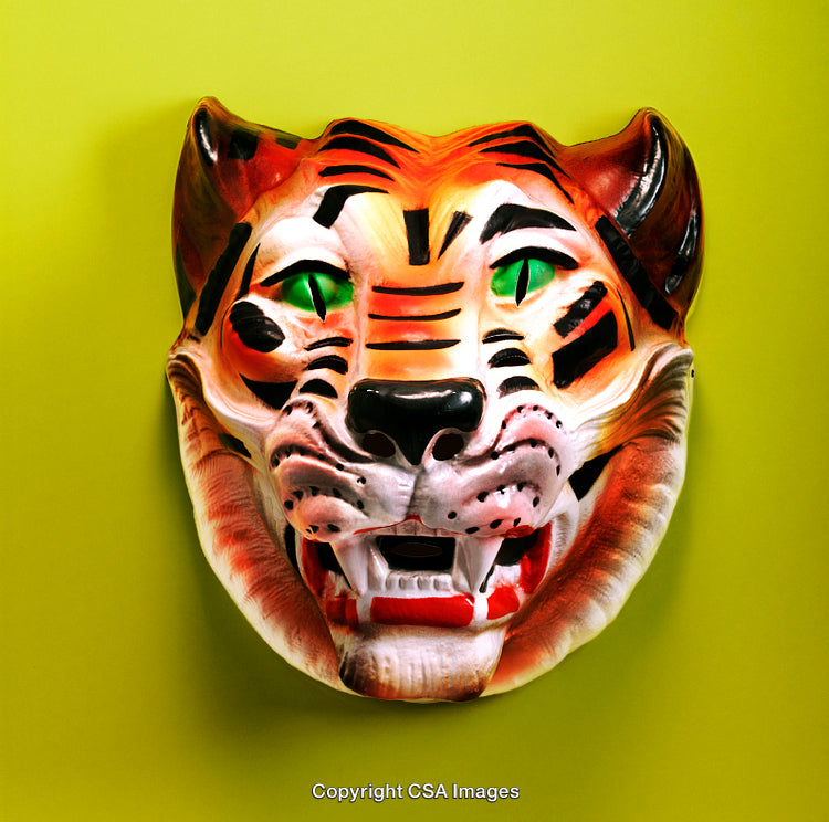 Colorful Tiger Mask with Vibrant Expression on a Green Background