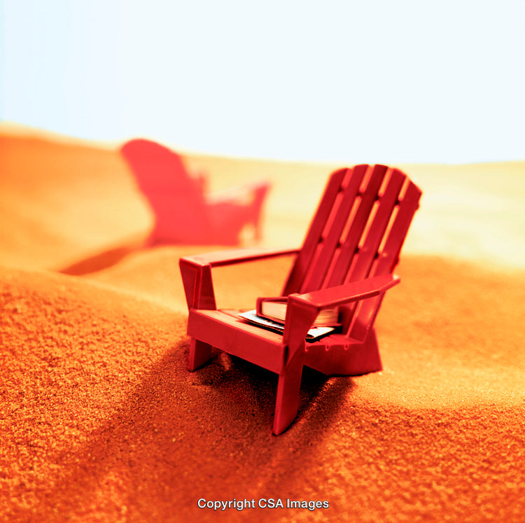 Red Adirondack Chairs on Orange Sand with Dreamy Atmosphere