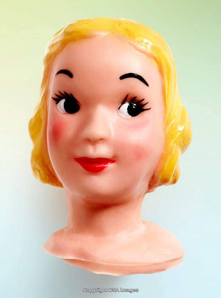 Vintage Blonde Plastic Doll Head on Pastel Gradient Background