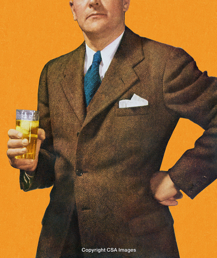Man in Classic Suit Holding a Glass of Beverage Against Orange Backdrop