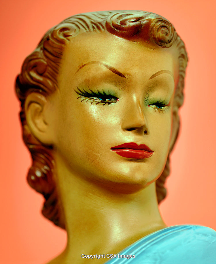 Vintage Woman Figurine with Retro Charm on a Colorful Background