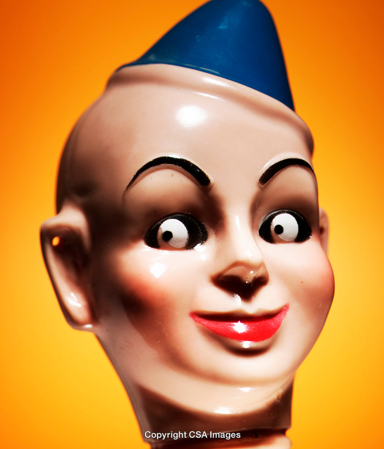 Close-Up of a Colorful Toy Head Against a Bright Background
