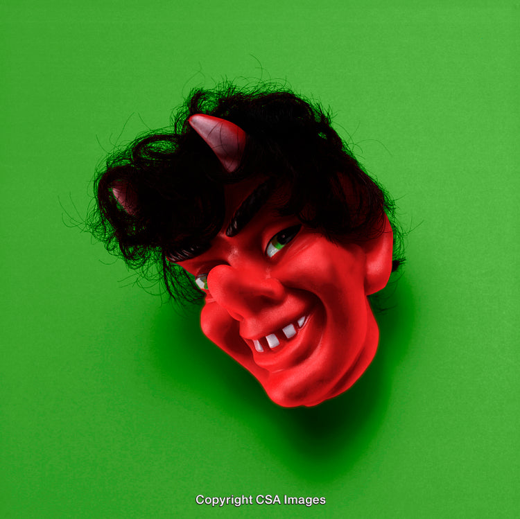 Red Devil Mask Against Green Background for Halloween or Costume Theme