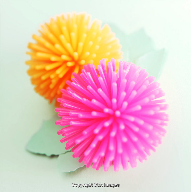 Vibrant Plastic Toy Balls with Bright Colors on Minimal Background