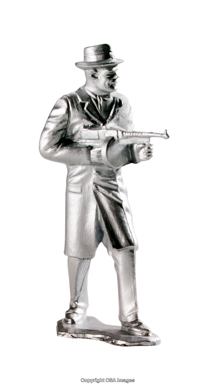 Plastic Figure of a Classic Detective Holding a Toy Machine Gun