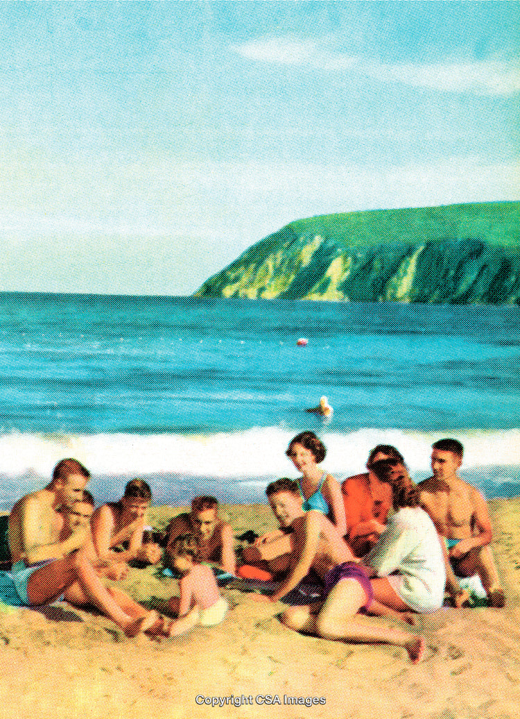 Group of People Enjoying at a Scenic Seaside Beach on a Sunny Day