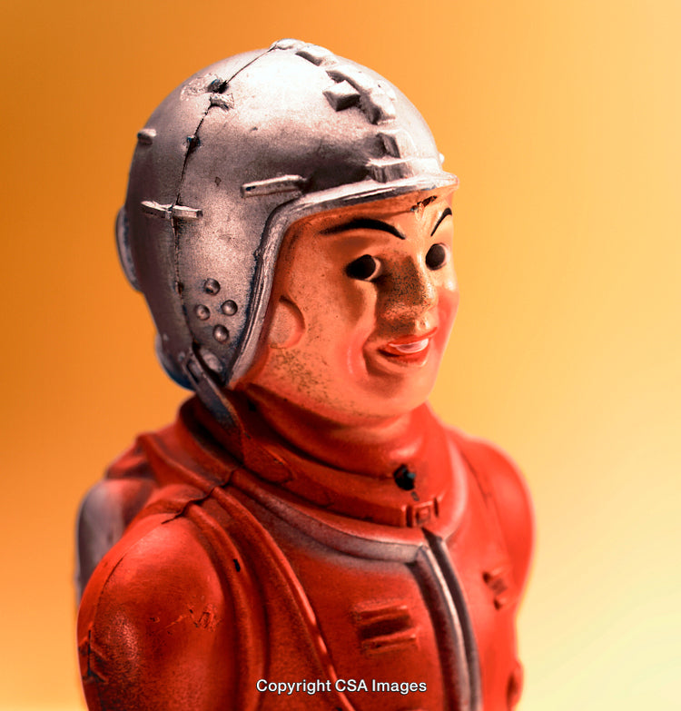Close-Up of Vintage Toy Soldier in a Red and Silver Outfit
