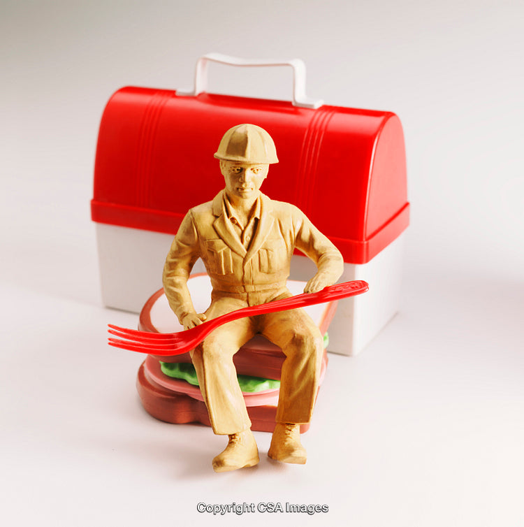 Toy Worker Figurine Sitting On Large Sandwich With Red Lunchbox