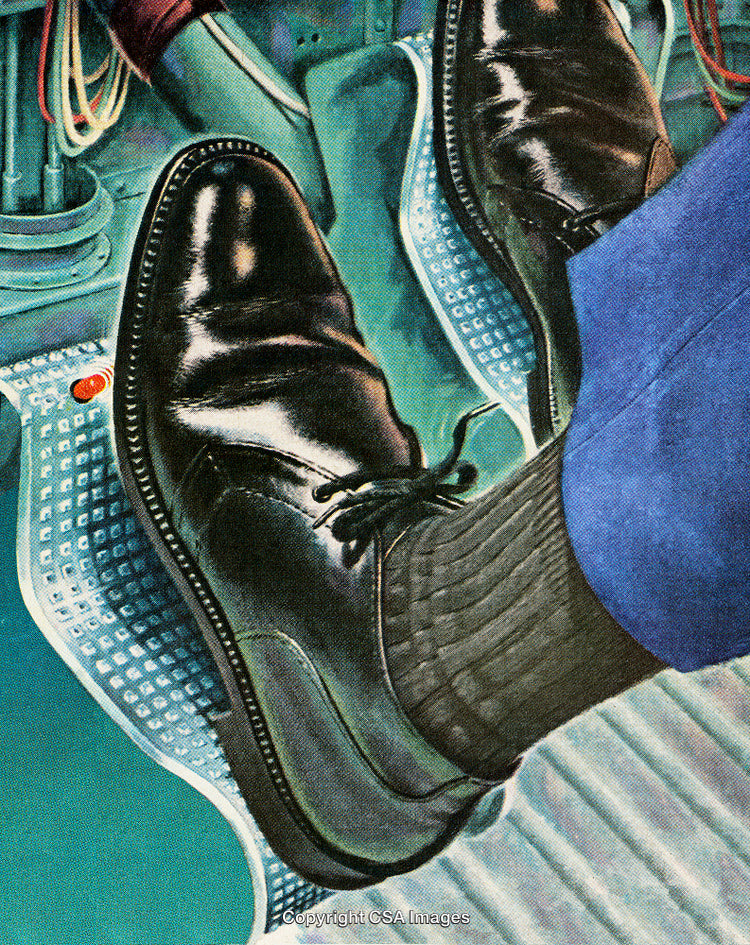 Close-Up of Footwear Operating Pedals in Machine Cockpit Perspective