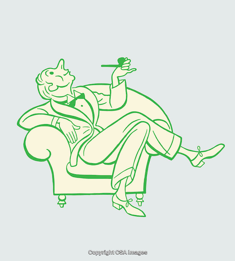 Elegant Man Relaxing in Armchair Holding a Glass of Brandy