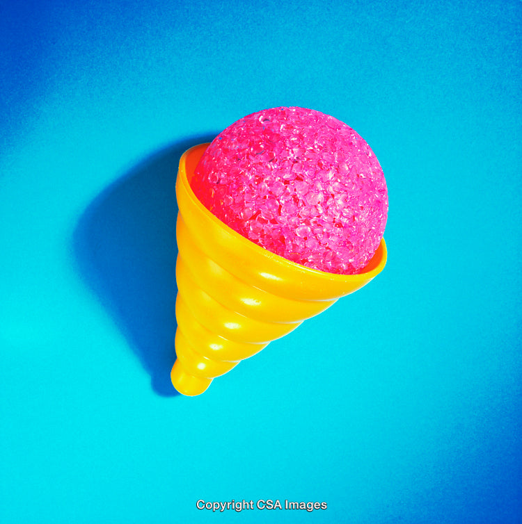 Bright Yellow Toy Ice Cream with Pink Glitter Scoop on Blue Background