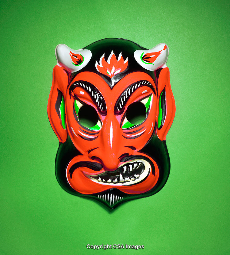 Colorful Traditional Mask Art Against Bright Green Background