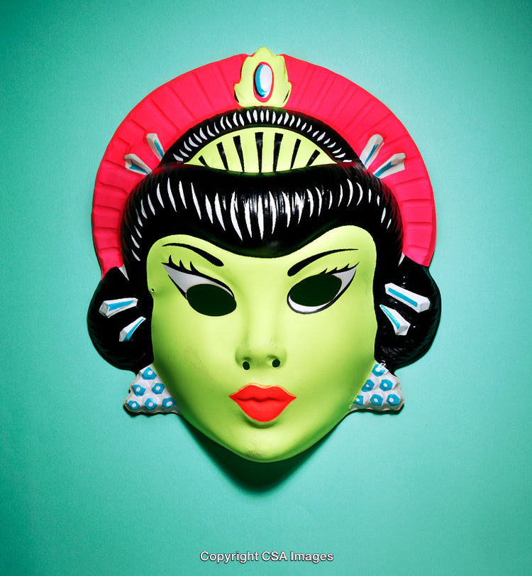 Close-Up of a Colorful Vibrant Retro Plastic Mask on Turquoise Background