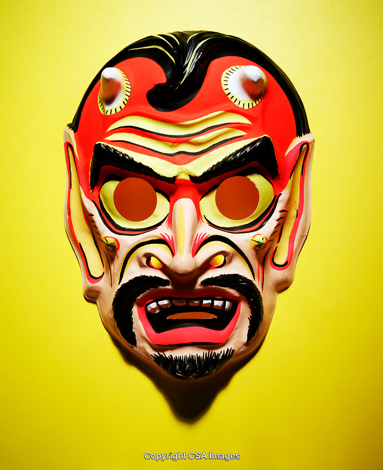 Colorful Red Demon Mask on a Bright Yellow Background