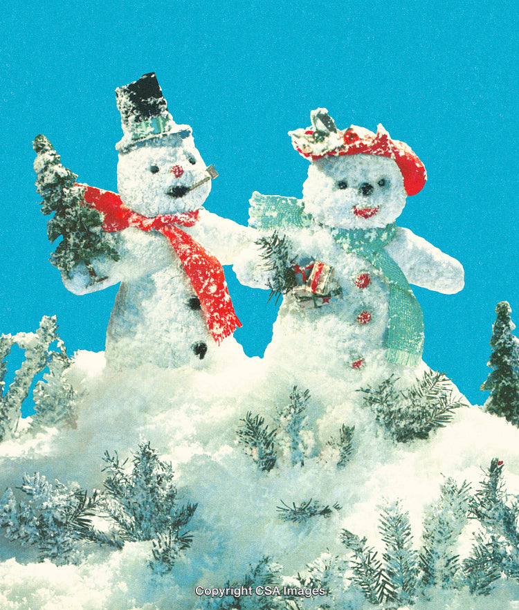 Snowman Family Enjoying Winter Wonderland Under Bright Blue Sky