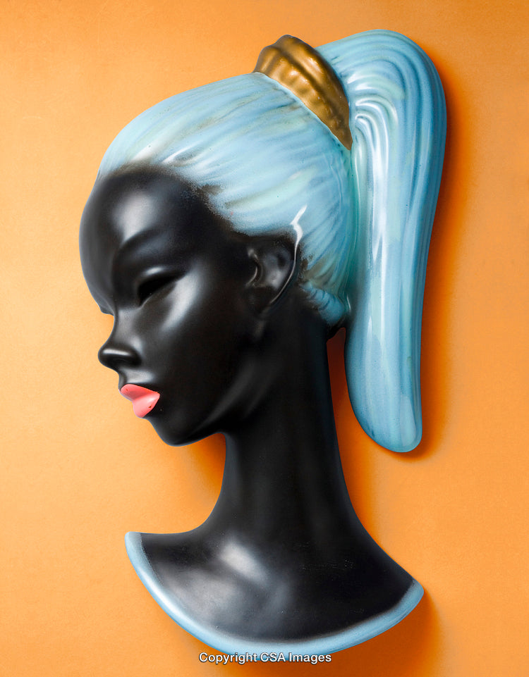 Stylish Ceramic Female Head With Retro Hair Design on Orange Background