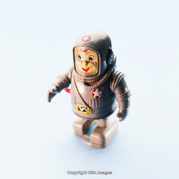 Vintage Plastic Toy Astronaut Figure in Detailed Spacesuit on Light Background
