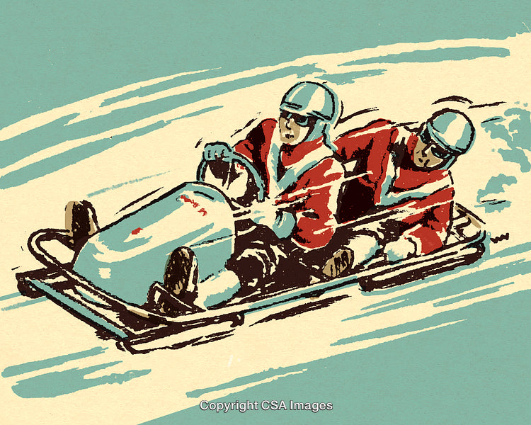 Two Athletes Racing in a Bobsled on a Snowy Track