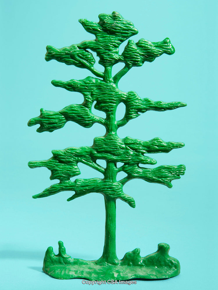 Green Plastic Tree Figure on a Light Blue Background