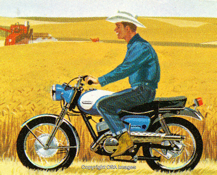 Man Riding a Vintage Motorcycle Through a Golden Wheat Field