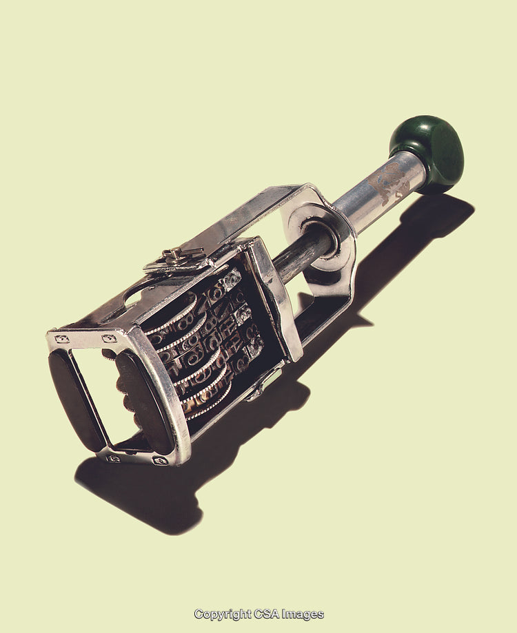 Vintage-Style Metal Date Stamp on a Pastel Background