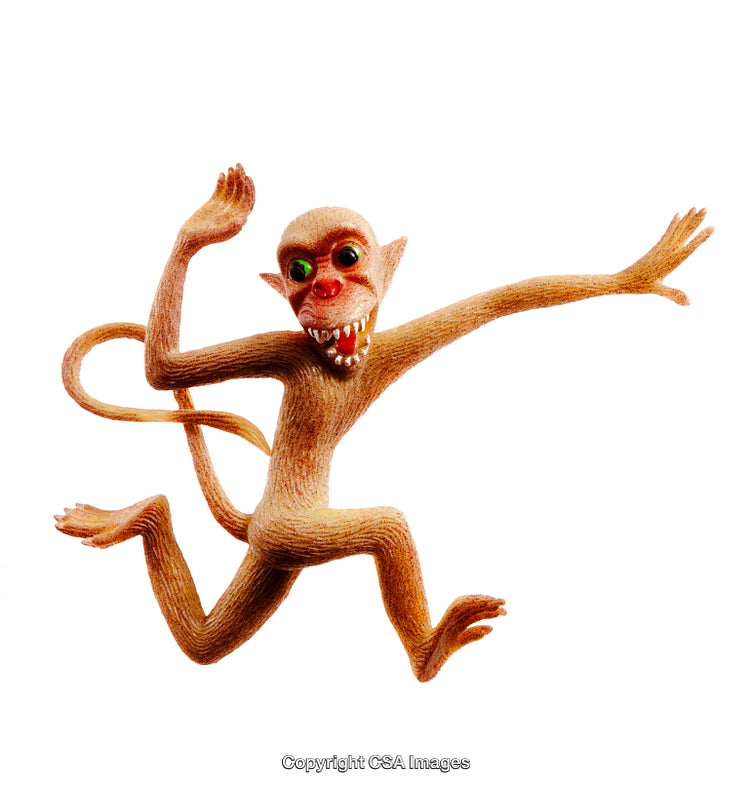 Energetic Monkey Toy Figure Posing Playfully Against White Background