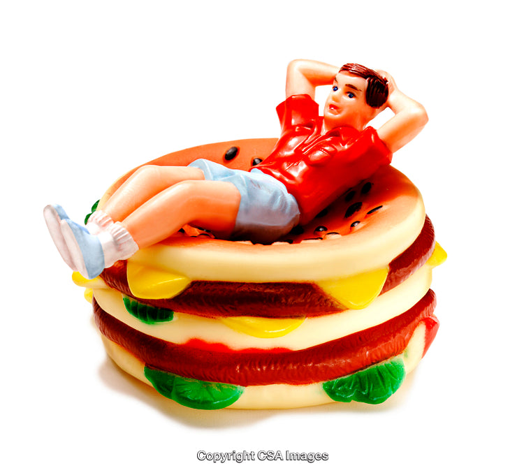 Playful Toy Figure Relaxing on a Colorful Hamburger Model