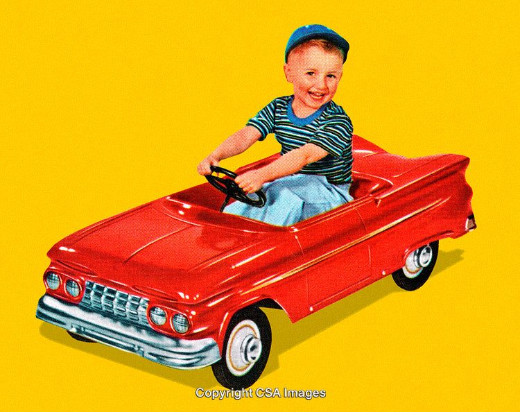 Young Boy Driving a Classic Pedal Car Against a Bright Yellow Background