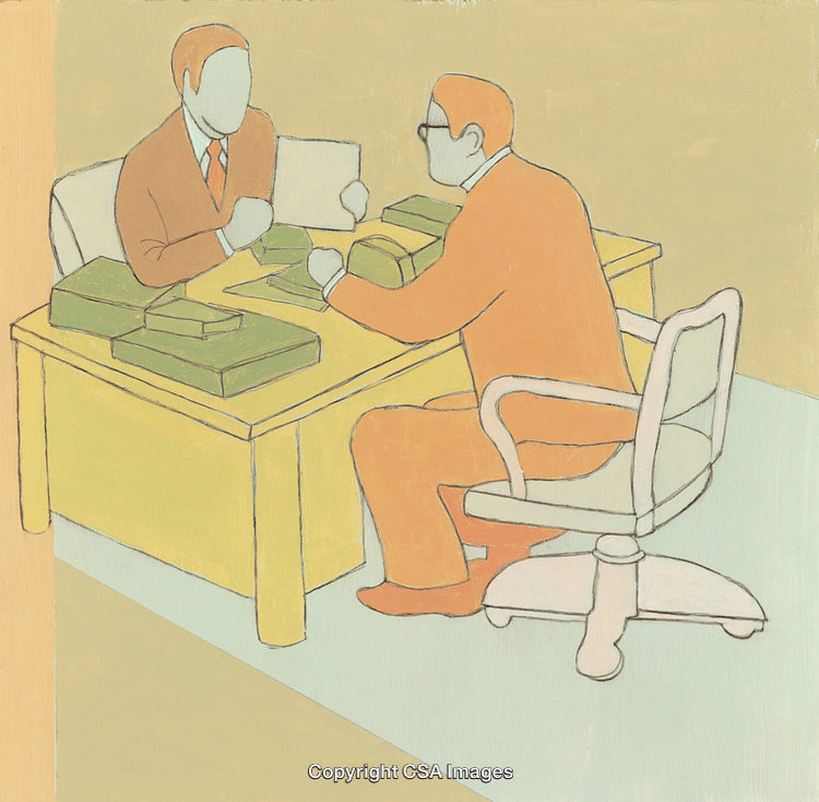 Two Colleagues Collaborating at Desk in Office Setting with Documents