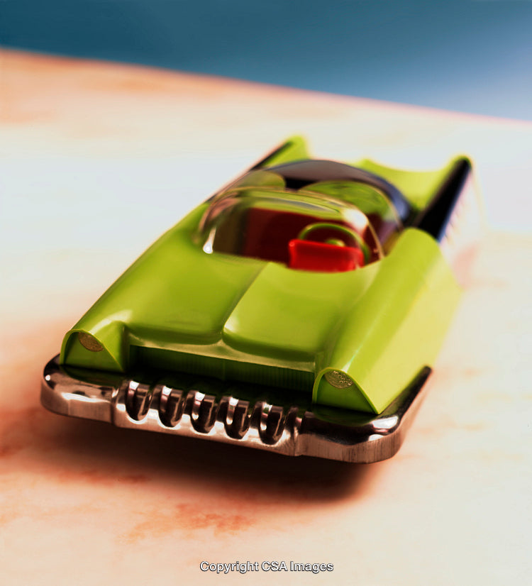 Close-Up of a Retro Plastic Toy Car in Bright Green