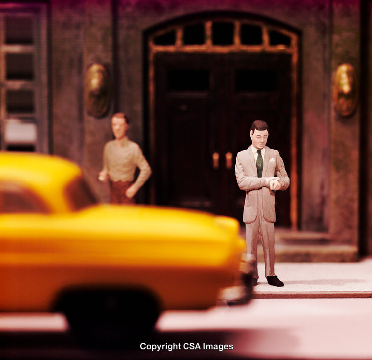 Miniature Diorama Scene Featuring Yellow Taxi and Figures in City Setting