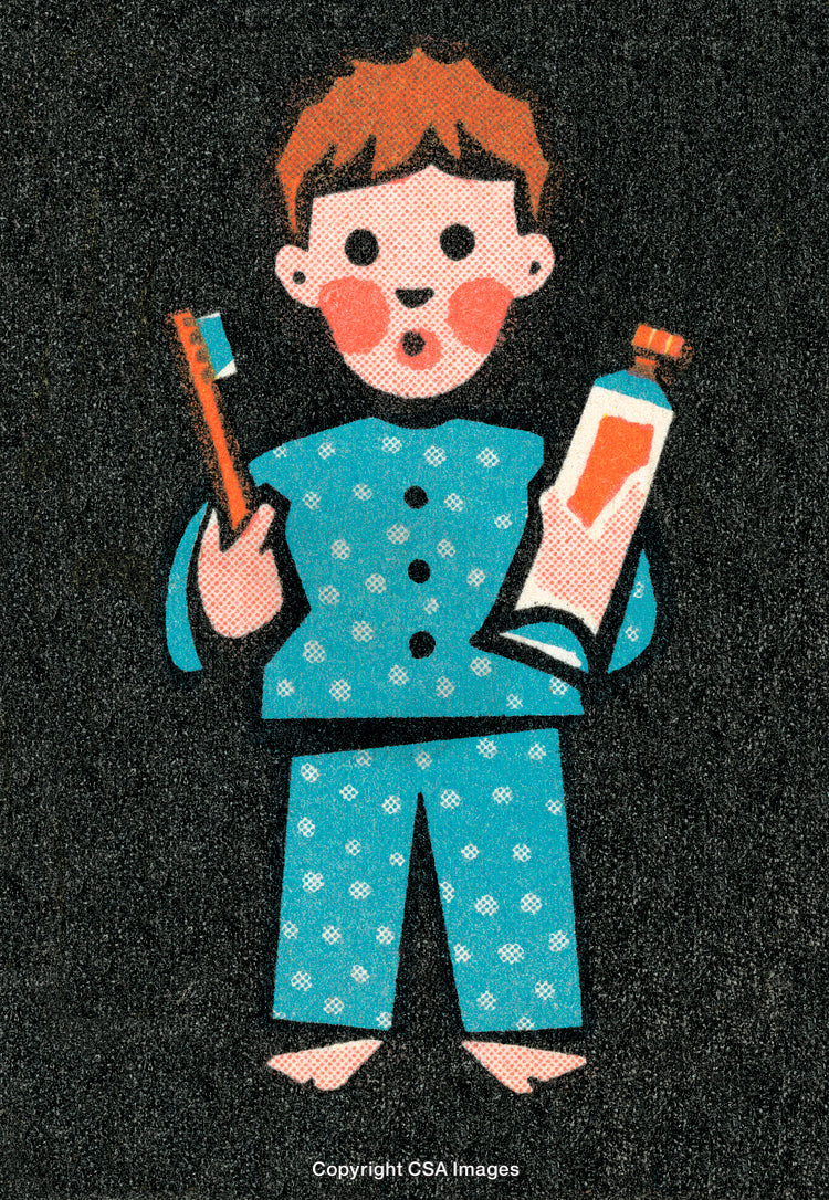 Child Holding Toothbrush and Toothpaste in Pajamas on Black Background