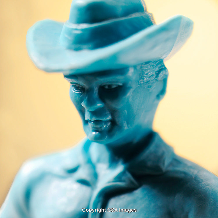 Artistic Close-Up of a Blue Plastic Cowboy Figure Sculpture
