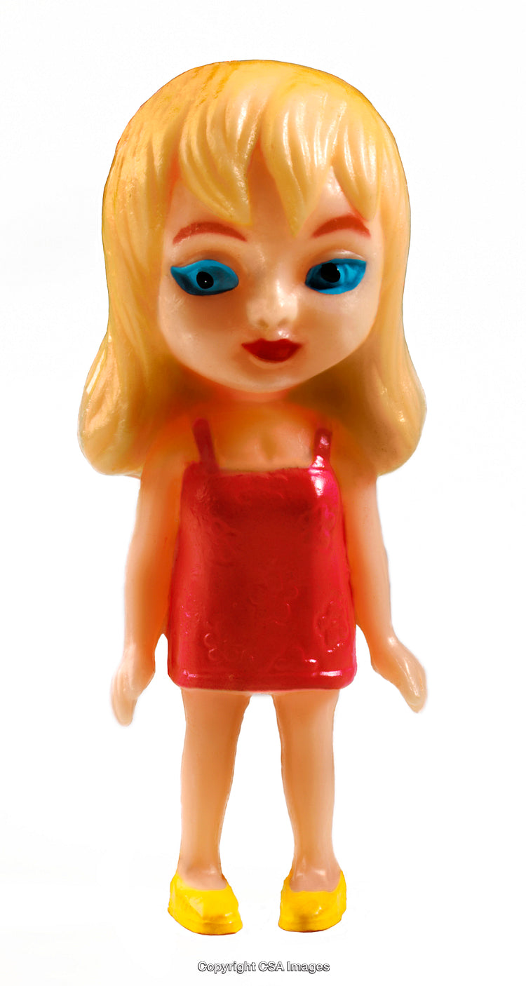 Close-Up of a Blonde Plastic Toy Doll in Red Dress