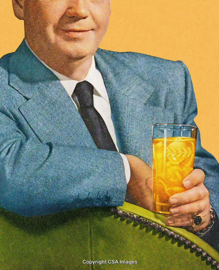 Man in Blue Suit Holding Glass of Refreshing Beverage