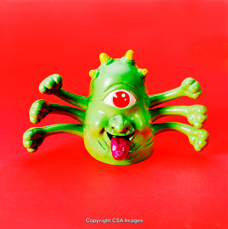 Green Monster Figurine With Red Eye and Vibrant Background