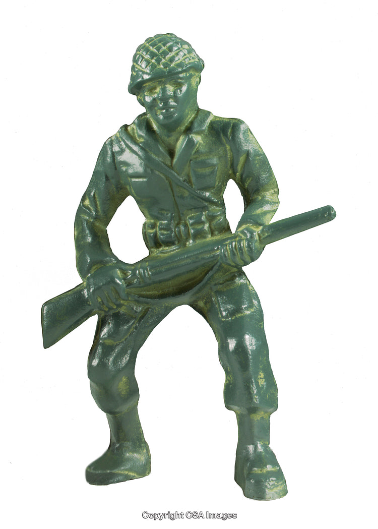 Green Plastic Toy Soldier Holding a Rifle in a Combat Stance