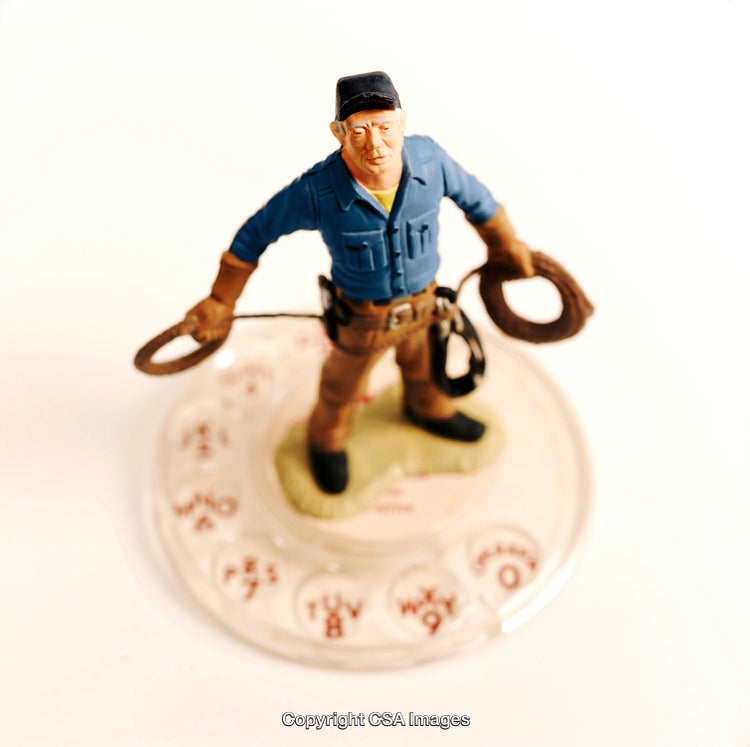 Plastic Toy Figure of a Worker with Coiled Ropes on Dial Base