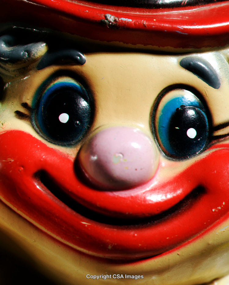 Close-Up of a Classic Vintage Clown Figurine with Bright Red Lips