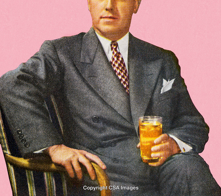 Elegant Gentleman Holding a Drink Relaxing in a Vintage Style Portrait
