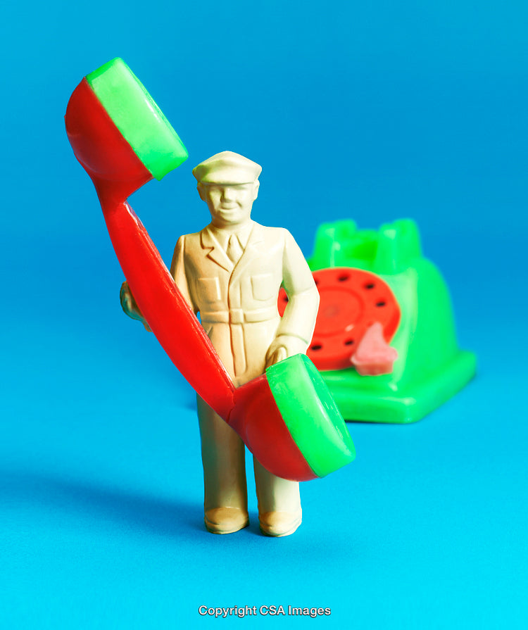 Colorful Toy Soldier Holding Telephone Receiver on Blue Background