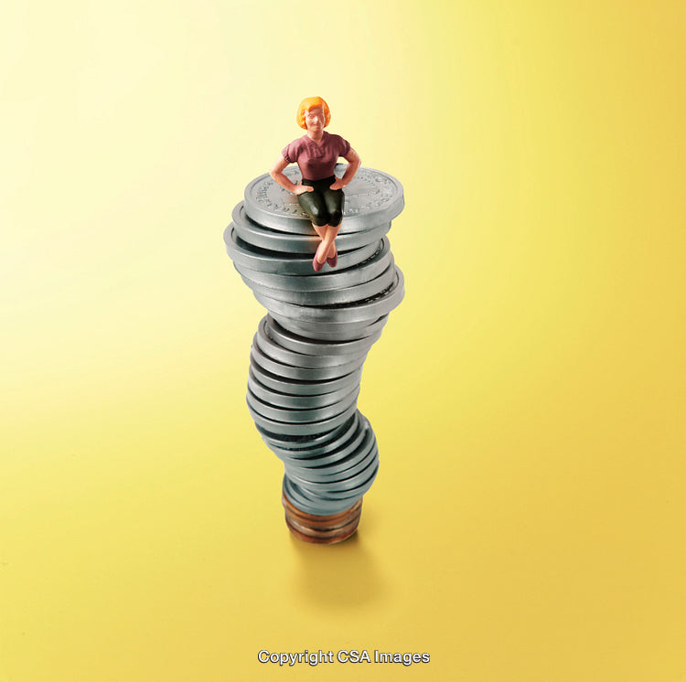Miniature Person on a Tower of Stacked Coins with Yellow Background