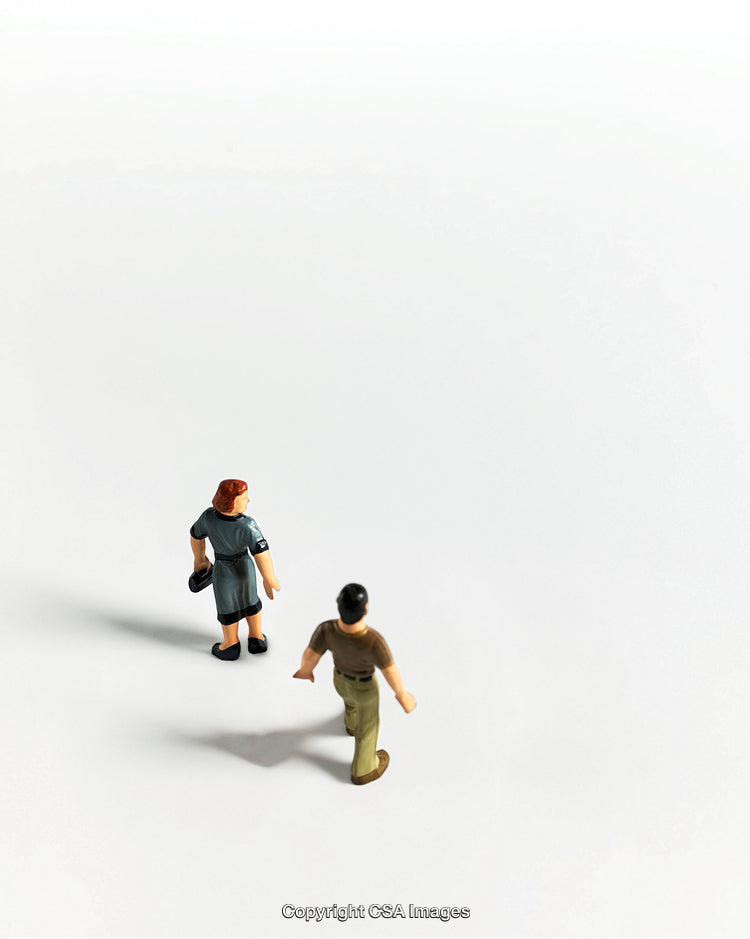Minimalist Composition with Figurines on White Background