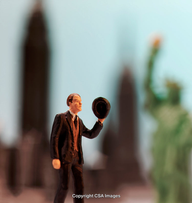 Miniature Figurine With Hat Against Iconic New York City Skyline